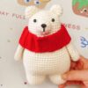 Cute white polar bear with red scarf