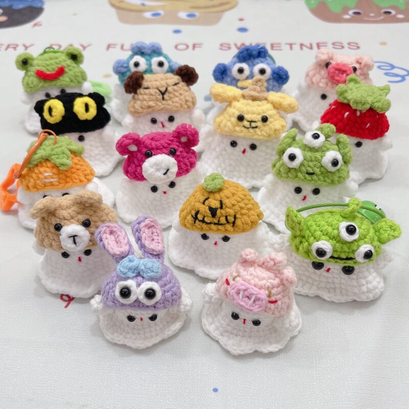 Little handmade crocheted ghosts with all kinds of cute hats