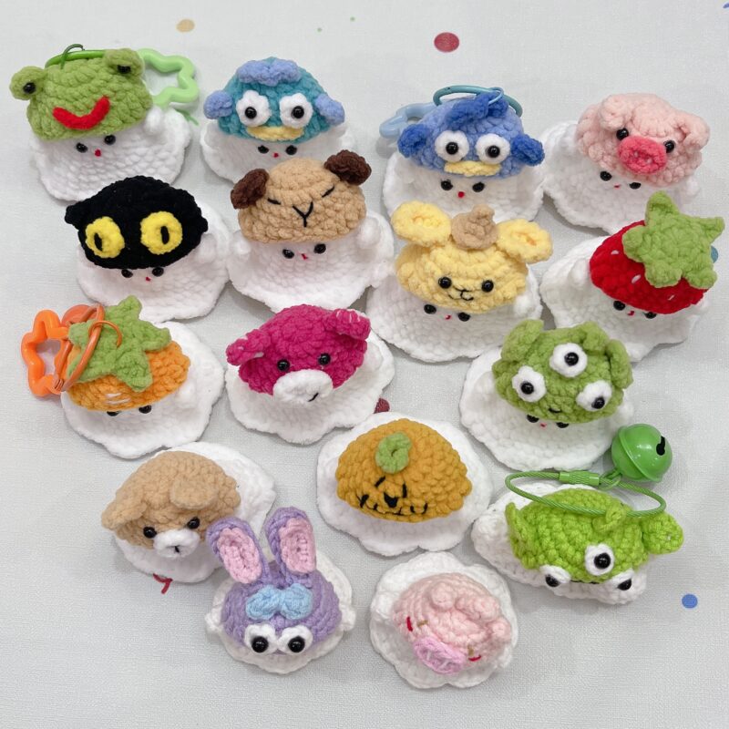 Little handmade crocheted ghosts with all kinds of cute hats