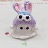 Little handmade crocheted ghosts with all kinds of cute hats