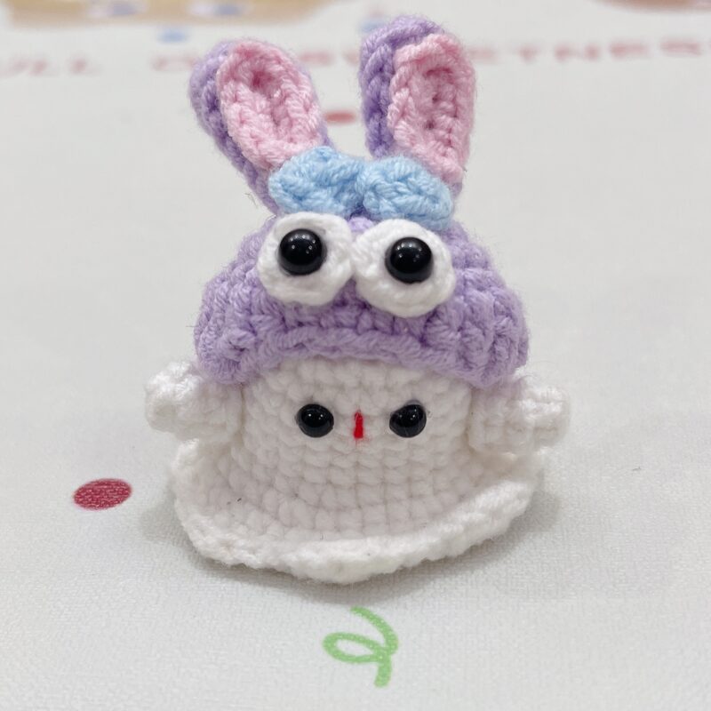 Little handmade crocheted ghosts with all kinds of cute hats