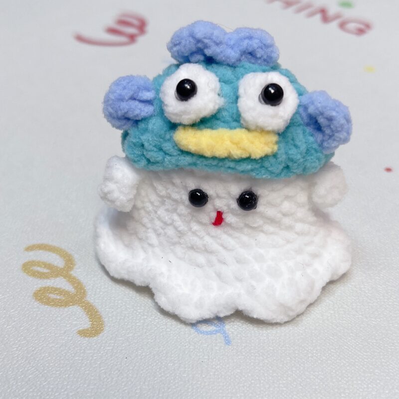 Little handmade crocheted ghosts with all kinds of cute hats