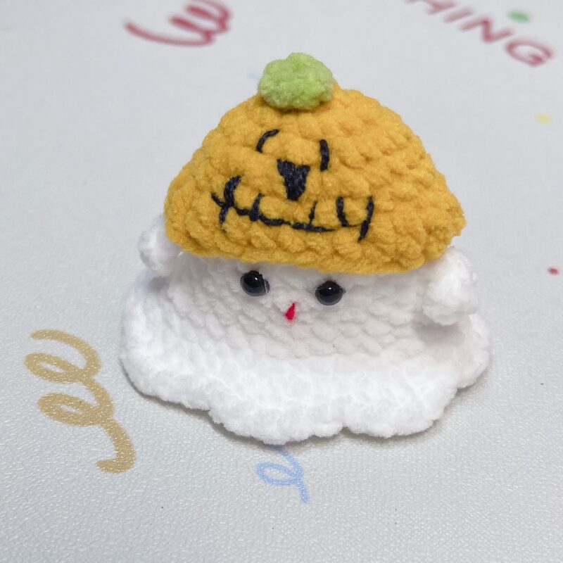 Little handmade crocheted ghosts with all kinds of cute hats