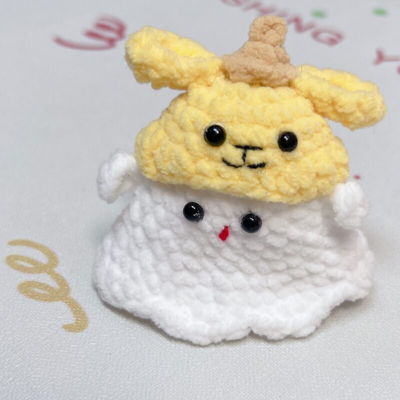 Little handmade crocheted ghosts with all kinds of cute hats