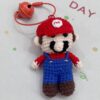 Handmade crocheted Mario dolls that can be used as ornaments or as key chains and pendants!
