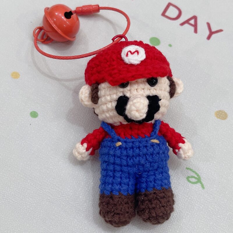 Handmade crocheted Mario dolls that can be used as ornaments or as key chains and pendants!