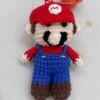 Handmade crocheted Mario dolls that can be used as ornaments or as key chains and pendants!